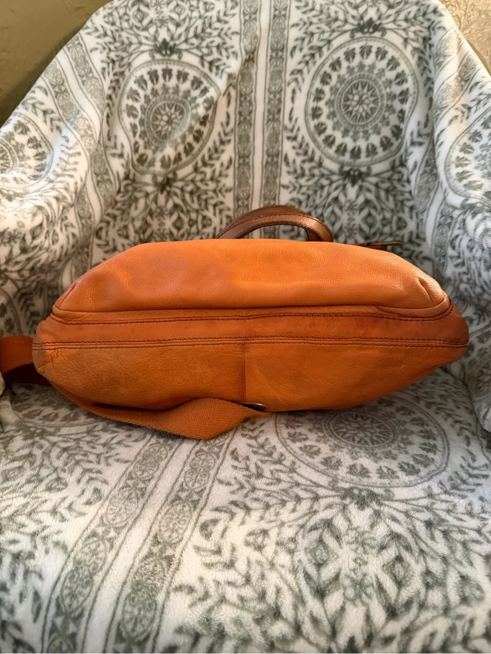 Fossil Explorer Fold Over Tote in orange on brass hardware